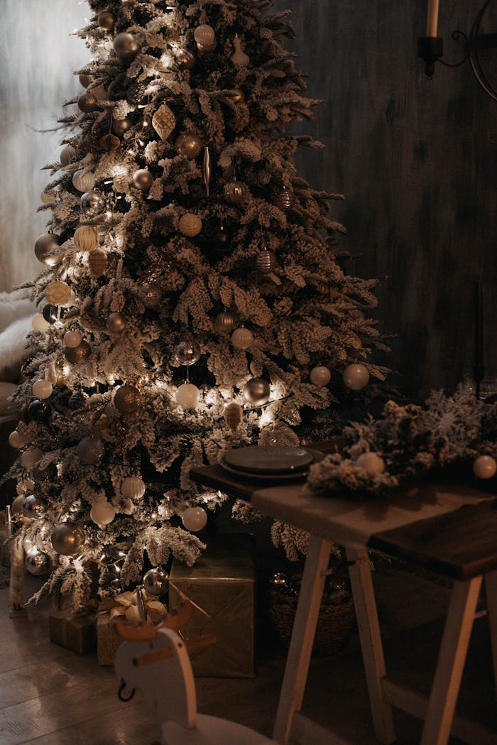 Beautifully decorated Christmas tree with lights in a cozy indoor setting, perfect for holiday themes.